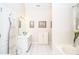 Bright bathroom with double vanity and a bathtub at 2832 Fieldstone Se Dr, Conyers, GA 30013