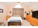 Bright bedroom with wood furniture and carpeted floor at 2832 Fieldstone Se Dr, Conyers, GA 30013