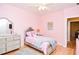 Pink bedroom with a twin bed and TV at 2832 Fieldstone Se Dr, Conyers, GA 30013