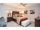 Basement bedroom with gray walls, a wooden bed frame, and a cozy sitting area at 2832 Fieldstone Se Dr, Conyers, GA 30013