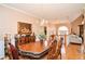 Formal dining room with hardwood floors and chandelier, view of living room at 2832 Fieldstone Se Dr, Conyers, GA 30013