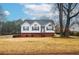 Brick and white ranch home with attached garage and landscaped yard at 2832 Fieldstone Se Dr, Conyers, GA 30013