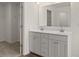 Bathroom boasts double vanity and a large mirror at 13218 E Tolstoy Se Drs, Covington, GA 30014