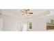 Bright bedroom with ceiling fan and large windows at 13218 E Tolstoy Se Drs, Covington, GA 30014