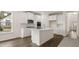 Modern kitchen with white cabinets and kitchen island at 13218 E Tolstoy Se Drs, Covington, GA 30014