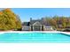 Community lap pool with adjacent clubhouse at 13218 E Tolstoy Se Drs, Covington, GA 30014