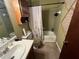 Clean bathroom with shower/tub combo, vanity, and updated toilet at 4198 Wellington Hills Ln, Snellville, GA 30039