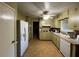 Galley kitchen with ample counter space at 4198 Wellington Hills Ln, Snellville, GA 30039