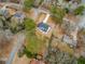 Aerial view of modern farmhouse on large lot with mature trees and long driveway at 467 Concord Sw Rd, Smyrna, GA 30082