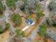 Aerial view of a home with a pool surrounded by lush greenery and mature trees at 467 Concord Sw Rd, Smyrna, GA 30082