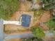 Aerial view of new construction with long driveway, fenced-in yard, and new roof at 467 Concord Sw Rd, Smyrna, GA 30082