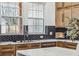 Bright kitchen with black hexagon backsplash, stainless appliances, and white marble countertops at 467 Concord Sw Rd, Smyrna, GA 30082