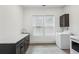 Spacious laundry room with sink, counter space, cabinets, and modern washer and dryer at 467 Concord Sw Rd, Smyrna, GA 30082