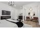 Modern main bedroom with fireplace, television, hardwood floors and sitting area at 467 Concord Sw Rd, Smyrna, GA 30082