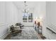 Bright sitting room with natural light, modern chandelier, and two comfortable chairs at 467 Concord Sw Rd, Smyrna, GA 30082