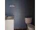 Small bathroom with white toilet and sink at 1604 Pine Tree Trl, Atlanta, GA 30349