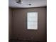 Small bedroom with window and blinds at 1604 Pine Tree Trl, Atlanta, GA 30349