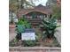 Pine Tree Condominium entrance sign with landscaping at 1604 Pine Tree Trl, Atlanta, GA 30349