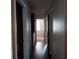 Long hallway with doors to other rooms at 1604 Pine Tree Trl, Atlanta, GA 30349