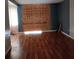 Living room with hardwood floors and partial wall at 1604 Pine Tree Trl, Atlanta, GA 30349