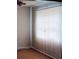 Empty living room with hardwood floors and window coverings at 1604 Pine Tree Trl, Atlanta, GA 30349