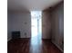 Spacious living room with hardwood floors and access to garage at 1604 Pine Tree Trl, Atlanta, GA 30349