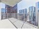 Condo balcony with views of city buildings, a metal railing and neutral flooring at 20 10Th Nw St # 901, Atlanta, GA 30309