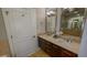 Double vanity bathroom with granite countertops and large mirror at 20 10Th Nw St # 901, Atlanta, GA 30309