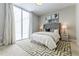 Bedroom with large windows and a geometric-patterned rug at 20 10Th Nw St # 901, Atlanta, GA 30309