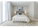 Bright bedroom features large windows and a geometric-patterned rug at 20 10Th Nw St # 901, Atlanta, GA 30309