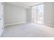 Bright, spacious bedroom features new carpet and large windows with a city view at 20 10Th Nw St # 901, Atlanta, GA 30309