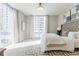Bedroom boasts natural light, modern decor, and city views at 20 10Th Nw St # 901, Atlanta, GA 30309