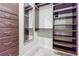 Spacious walk-in closet with custom shelving, drawers, and ample storage space at 20 10Th Nw St # 901, Atlanta, GA 30309