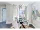 Modern dining area features designer lighting and neutral decor, next to balcony at 20 10Th Nw St # 901, Atlanta, GA 30309