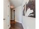 Inviting hallway with hardwood floors, white trim, and stylish artwork at 20 10Th Nw St # 901, Atlanta, GA 30309