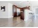 Modern kitchen features stainless steel appliances, dark wood cabinets, a breakfast bar and hardwood floors at 20 10Th Nw St # 901, Atlanta, GA 30309