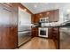 Gourmet kitchen with stainless steel appliances, custom cabinetry, and modern lighting at 20 10Th Nw St # 901, Atlanta, GA 30309