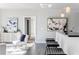 Stylish living area with modern furniture and decor, adjacent to a full bar at 20 10Th Nw St # 901, Atlanta, GA 30309