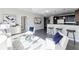 Bright living room features plush seating and open access to kitchen and bar at 20 10Th Nw St # 901, Atlanta, GA 30309