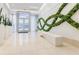 Lobby with decorative plants, modern white seating and contemporary wall design at 20 10Th Nw St # 901, Atlanta, GA 30309
