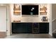 Basement bar with floating shelves and a wine cooler at 255 Grogans Lake Pt, Atlanta, GA 30350