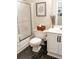 Clean bathroom with a shower/tub combo, toilet and white vanity at 255 Grogans Lake Pt, Atlanta, GA 30350