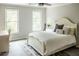 Bedroom with a queen-size bed and two windows at 255 Grogans Lake Pt, Atlanta, GA 30350