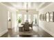 Formal dining room with hardwood floors and a large chandelier at 255 Grogans Lake Pt, Atlanta, GA 30350