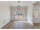 Bright dining room with hardwood floors and large window at 2839 Suttonwood Way, Buford, GA 30519