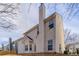 Two-story house with beige siding and a large backyard at 2839 Suttonwood Way, Buford, GA 30519