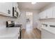 Modern kitchen with white cabinets and stainless steel appliances at 2839 Suttonwood Way, Buford, GA 30519