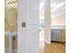 Small bathroom with pedestal sink and view of kitchen at 375 Highland Ave # 202, Atlanta, GA 30312