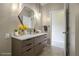 Modern bathroom with floating vanity, hexagon mirror, and tile floors at 375 Highland Ave # 202, Atlanta, GA 30312