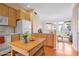 Kitchen with light wood cabinets, stainless steel appliances, and an island at 375 Highland Ave # 202, Atlanta, GA 30312